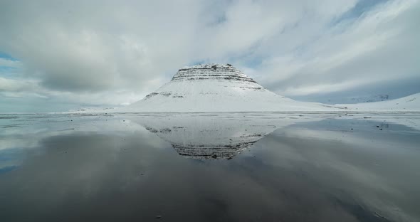 Timelapse View of Kirkjufell Mountain,reflections on Water and Fast Moving Clouds. Iceland in the