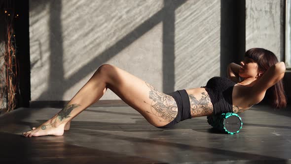 Woman Exercising with Foam Roller alt