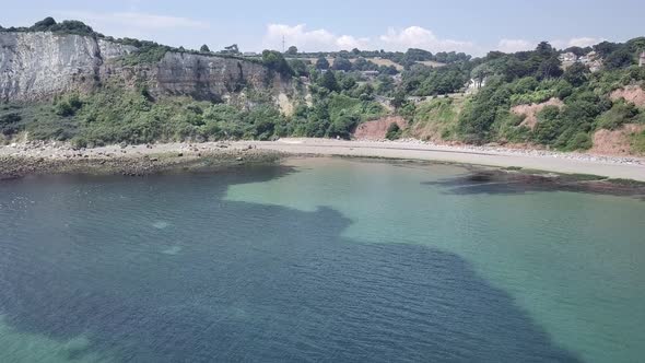 Sky view of the beach and landscape of Seaton, a historical town dating back to Roman times. Red col alt