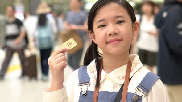 Asian Girl Showing Train Ticket While Travel In Japan alt