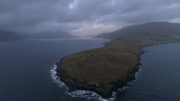 Drone footage of an peninsula in fjord of Faroe Islands 