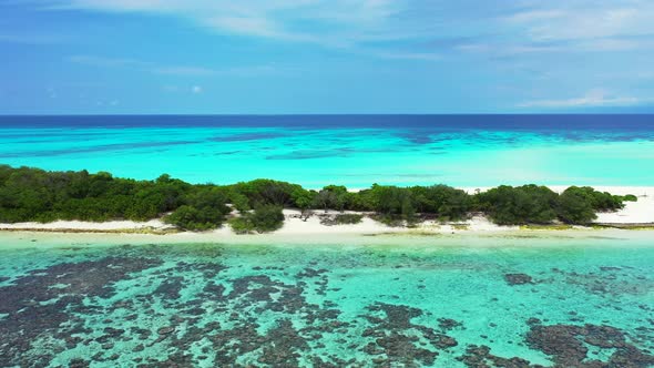 Daytime above abstract shot of a white sand paradise beach and turquoise sea background in 4K alt