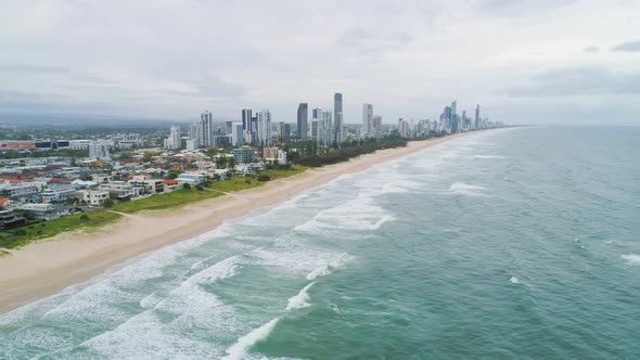 Aerial pan showing scenic Gold Coast high rise coastline and Mermaid Beach in Queensland, Australia