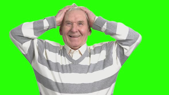 Happy Old Man Holding Hands on Head alt