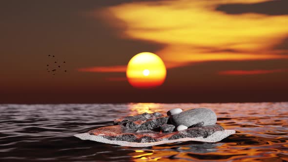 Rock in the ocean with sunset.