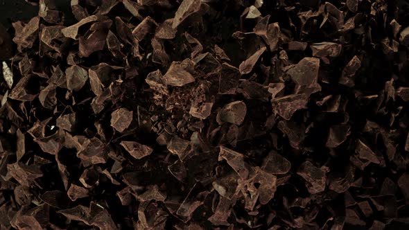Super Slow Motion Shot of Raw Chocolate Chunks after Being Exploded at 1000fps. alt