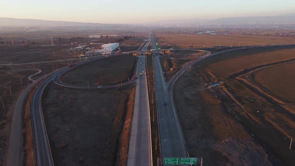 Highway Traffic At Sunset