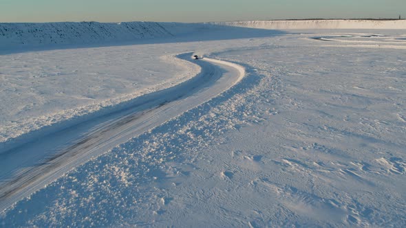 Aerial View of an Ice Rally on a Snowy Track alt