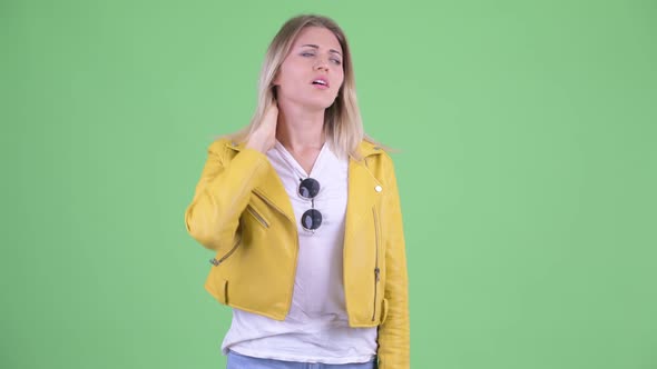 Stressed Young Rebellious Blonde Woman Having Neck Pain alt