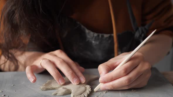 Talented Artist Work with Different Pottery Tools alt