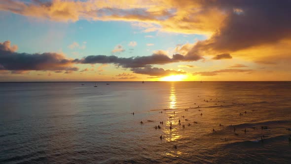Drone View, Radical Surfers Catching Sets of Waves at Sunset On Famous Waikiki Beach, Dawn Patrol Ha alt