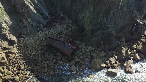 Flyover Shipwreck Of RMS Mulheim Cargo Ship At Land's End United Kingdom - aerial shot alt