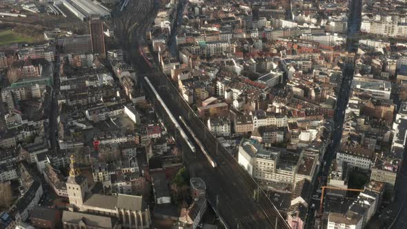 AERIAL: European Railway System in Cologne Germany with Two Trains Crossing  alt