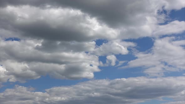 Clouds Illuminated By Sunlight Hover Beautifully in the Heaven Time-lapse alt