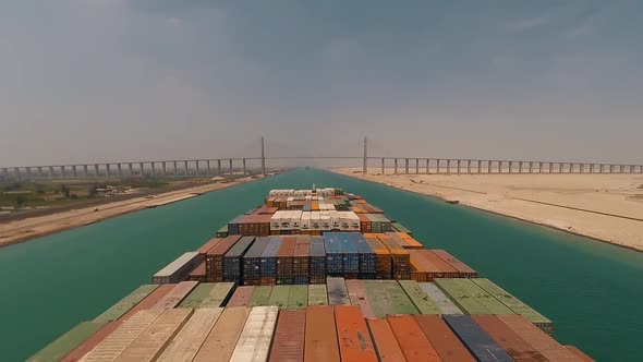 Suez, Egypt - huge container vessel proceeding through the Suez Canal. Time lapse