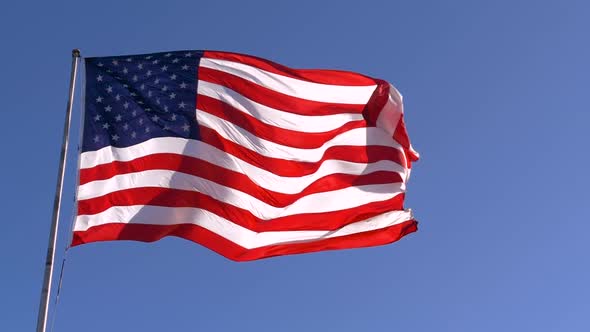 USA Flag on Flagpole, Slow Motion. American Dream