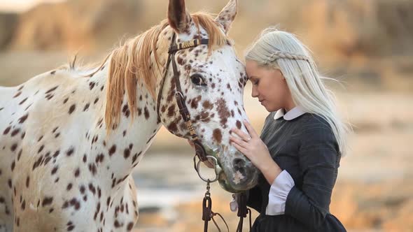 Sensual Woman Embracing Horse in Sunlight