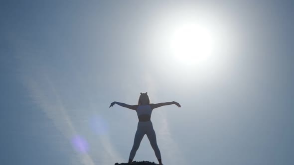 The Silhouette of the Girl in Front of the Sun.