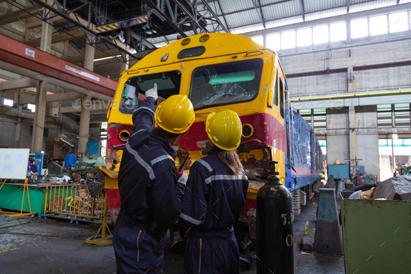 Engineer in the process of inspecting train engines Keep the machine ...