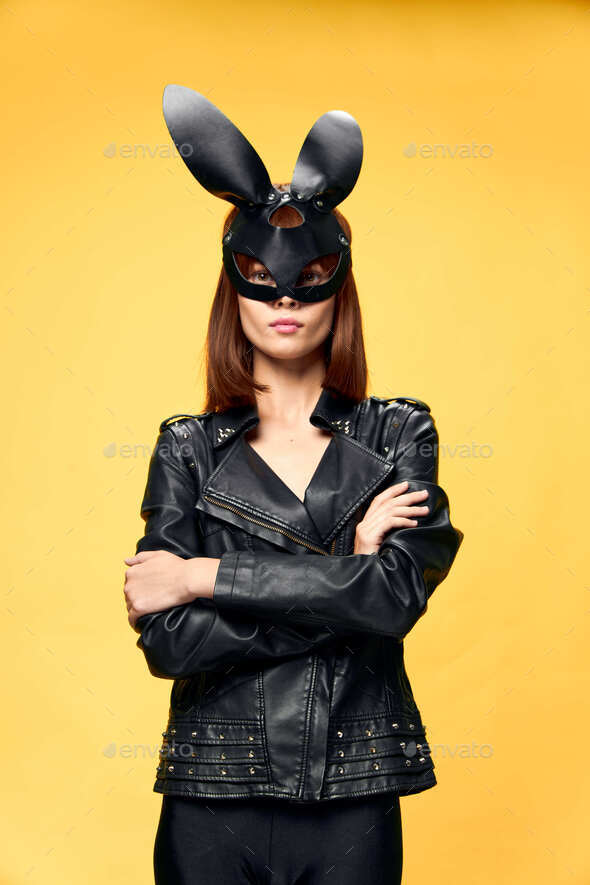 Sexy woman in rabbit mask and black suit, temptation Stock Photo by