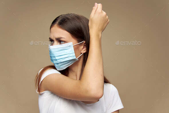 Beautiful girl fashion clothes in a protective mask health prevention