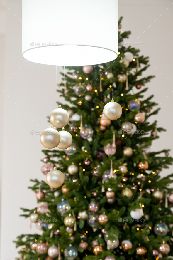 Big beautiful christmas tree decorated with beautiful shiny baubles and