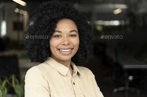 Confident portrait successful smiling African American woman, sales manager, CEO looking at camera.