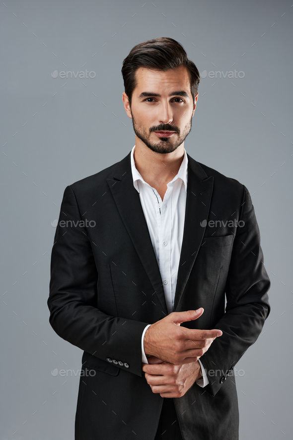 Premium Photo | Handsome male model posing wearing a blue suit.