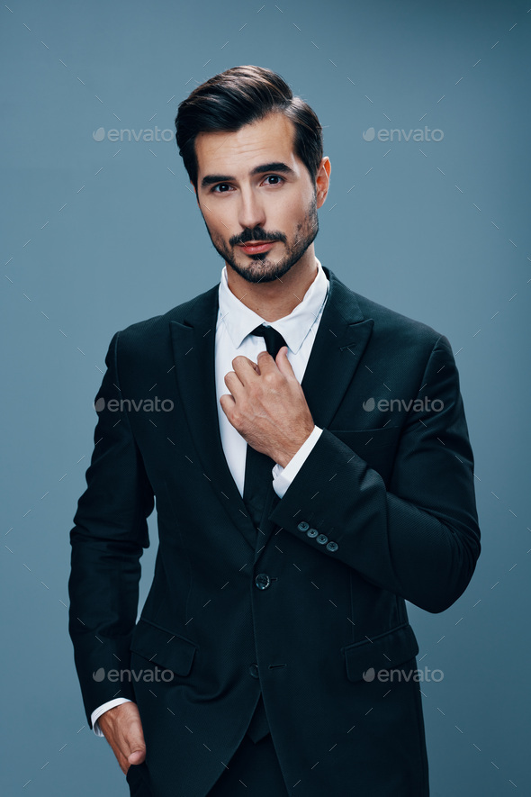 Elegant handsome man in classical jacket poses outdoor Stock Photo by  ©innervision 116745842