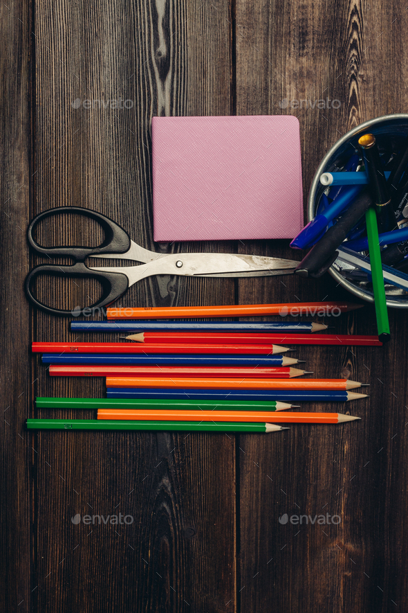 pencils for drawing notepad scissors office wooden table Stock Photo by  shotprime