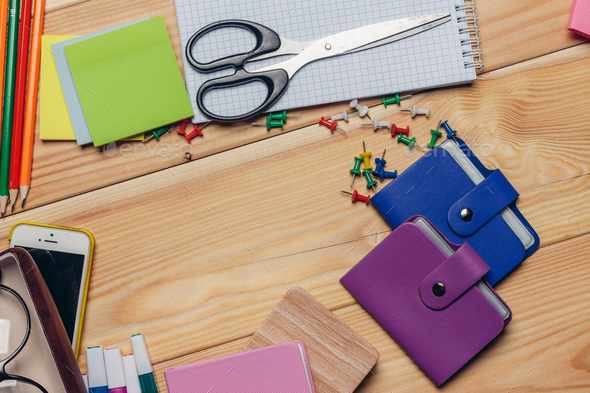 office desk with stationery and scissors pencils business card holder in  hands Stock Photo by shotprime