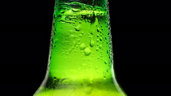 Neck of a Beer Bottle with Water Drops