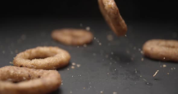 Onion rings close up slow motion studio, tasty fast food