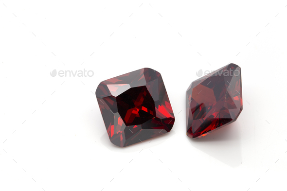 Closeup of red ruby gemstones isolated on a white background