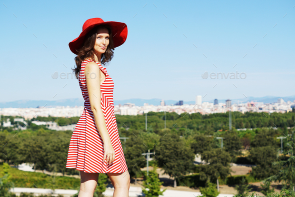 have tillid Plaske Relaterede Young Caucasian female in a striped dress and a red hat during a photoshoot  in Madrid, Spain Stock Photo by wirestock