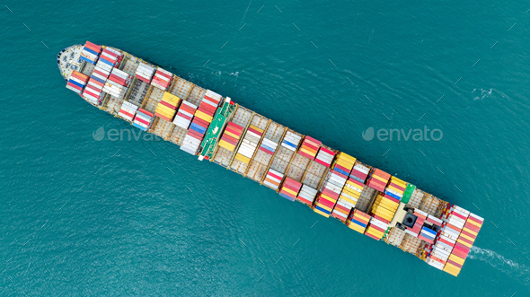 top view cargo ship carrying container and running for export goods from cargo yard port to customs