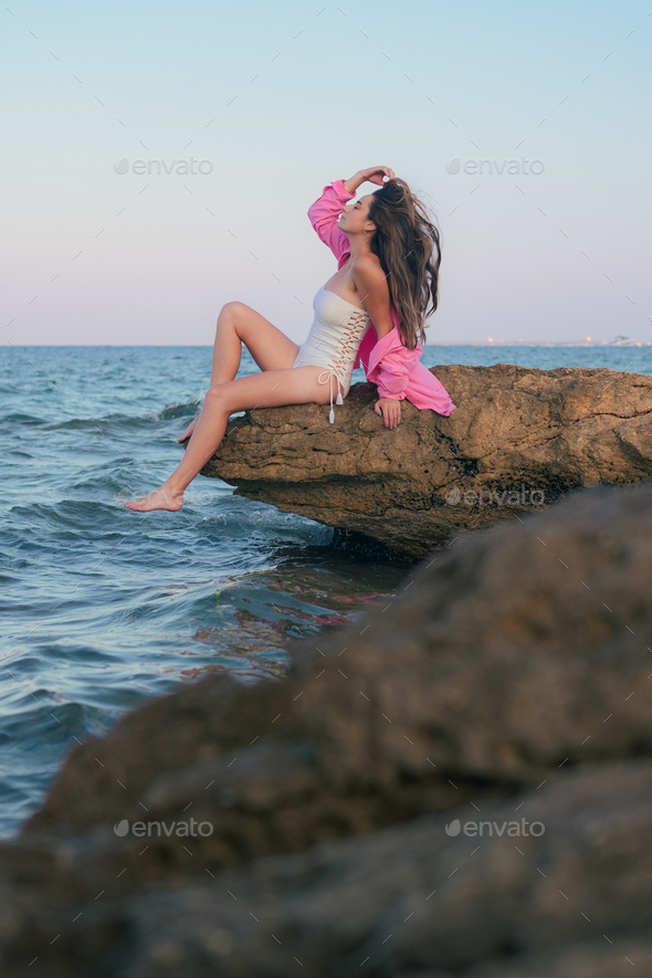 Beautiful Girl Long Black Dress Poses Sunset Sea Beautiful Sky Stock Photo  by ©gffrederik 312407894
