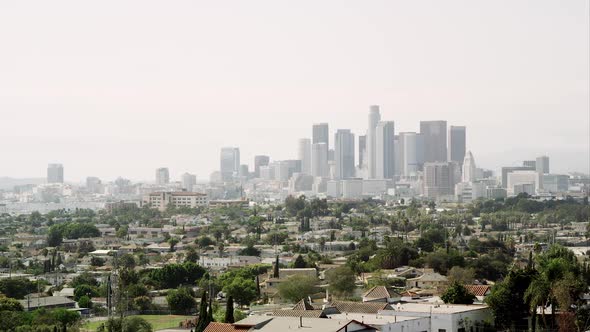 Panning view of Los Angeles with a smoggy sky alt