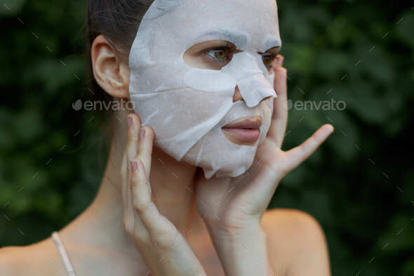 Nice woman Anti-wrinkle mask Touch your neck with your hands skin care