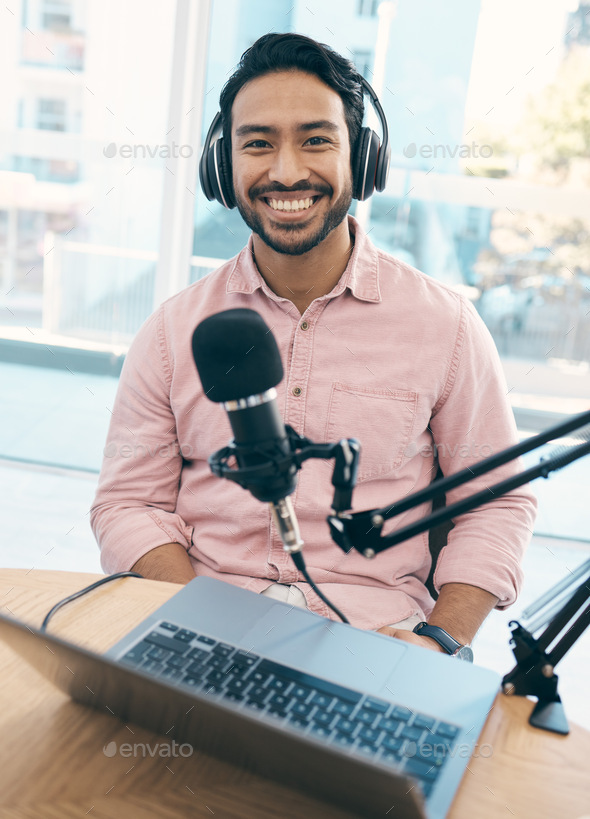Radio, podcast and portrait of happy asian man in studio live streaming talk show, blog or news ann
