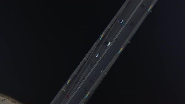 Aerial View Car Moving on River Bridge in City. Car Traffic on Hanging Bridge alt