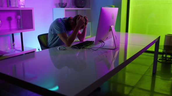 Disappointed Gamer Losing Tournament Round in Cozy Home Neon Cyberspace Studio alt