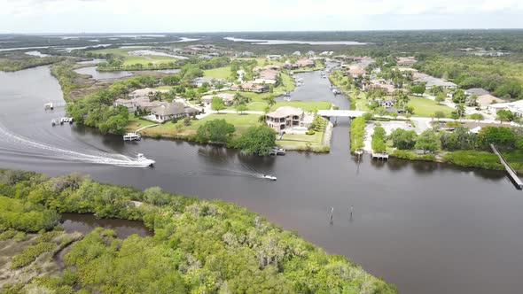 motorboats heading back to their upper Manatee County homes in Bradenton, Florida.  Excellent real e alt