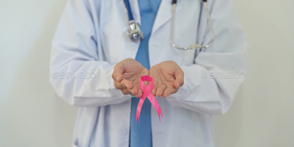 Pink October Breast Cancer Awareness month, doctor with pink ribbon symbol. National cancer