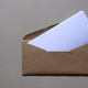 Brown envelope front with card inside on white background. Letter top view.  - PhotoDune Item for Sale