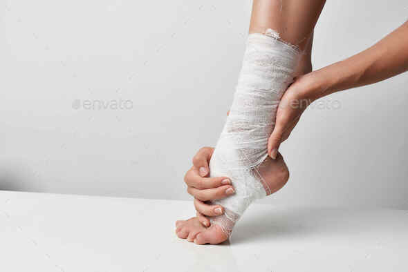 injured leg bandaged with a bandage health problem close-up Stock Photo by  shotprime