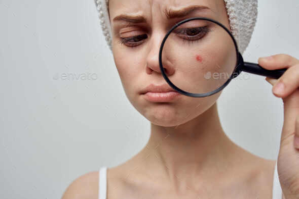 woman with a magnifying glass in hand cosmetology Studio Stock Photo by  shotprime