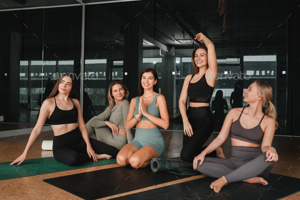 Women On Mats At Yoga Class In Fitness Studio Stock Photo, Picture