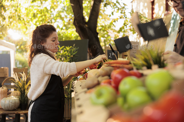 Young street vendor selling fresh fruits Vector Image