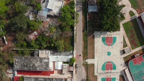 Aerial Birds Eye Overhead Top Down Panning View Street of Town in Poor Tropical Region alt